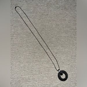 Stainless steel necklace and round pendant. NWOT